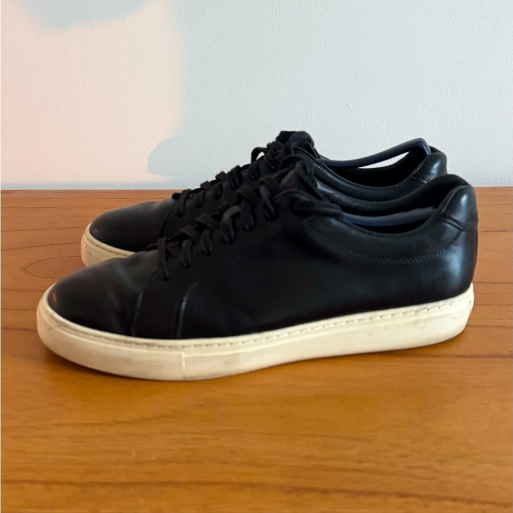 Cole Haan black leather sneakers.